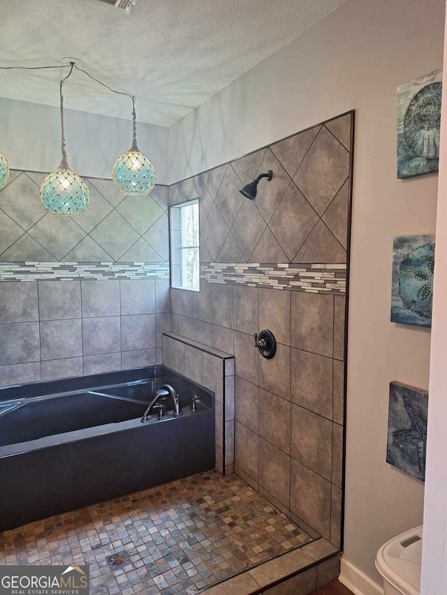 471 Getaway Ln, Baxley, GA 31513 - full bathroom with a garden tub, tiled shower, toilet, and baseboards