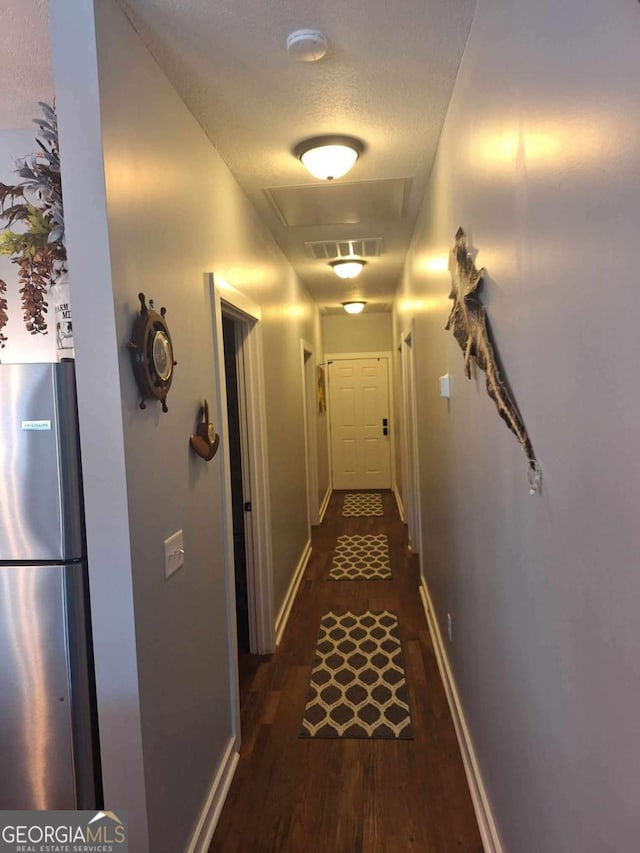 471 Getaway Ln, Baxley, GA 31513 - corridor with dark wood-type flooring, attic access, and baseboards