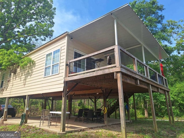 471 Getaway Ln, Baxley, GA 31513 - view of front of house featuring a patio area, a wooden deck, and stairs