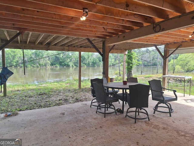 471 Getaway Ln, Baxley, GA 31513 - view of patio featuring a water view and outdoor dining space