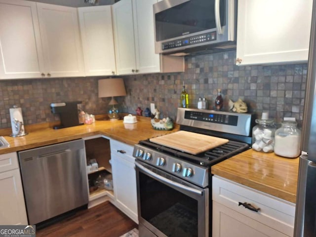 471 Getaway Ln, Baxley, GA 31513 - kitchen with appliances with stainless steel finishes, butcher block counters, white cabinetry, backsplash, and dark wood finished floors