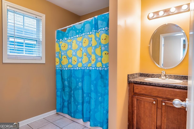 full bath featuring baseboards, a shower with shower curtain, tile patterned flooring, and vanity