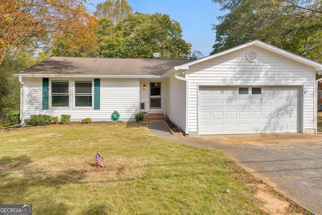 single story home featuring a front yard, an attached garage, roof with shingles, and concrete driveway