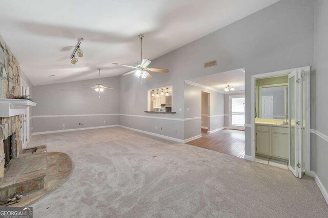 unfurnished sunroom featuring carpet, wood ceiling, and wood walls