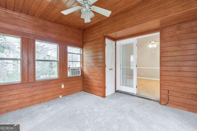 unfurnished sunroom featuring plenty of natural light and cooling unit