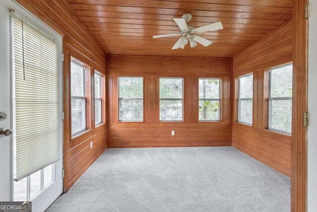 carpeted spare room with ornamental molding and baseboards