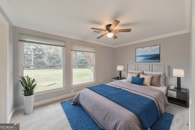 bedroom with light carpet, baseboards, crown molding, and ceiling fan