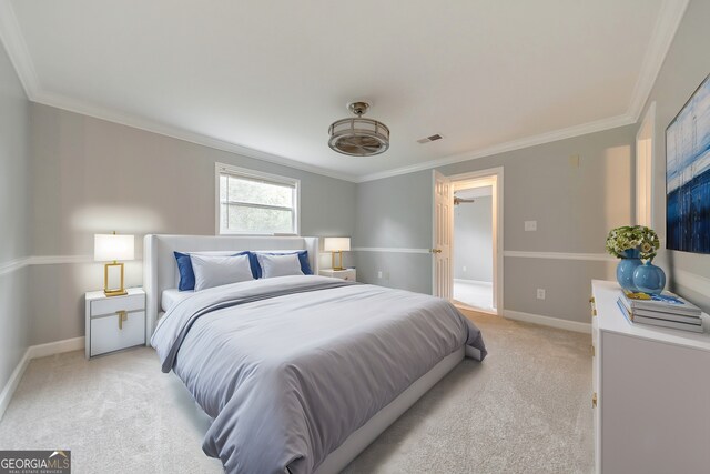 bedroom with light carpet, crown molding, and baseboards
