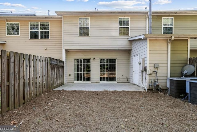 2872 Cross Creek Ct, Cumming, GA 30040 - back of property featuring a fenced backyard, cooling unit, and a patio