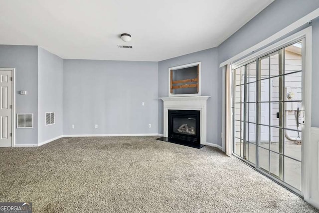 2872 Cross Creek Ct, Cumming, GA 30040 - unfurnished living room with a fireplace with flush hearth, baseboards, visible vents, and carpet floors