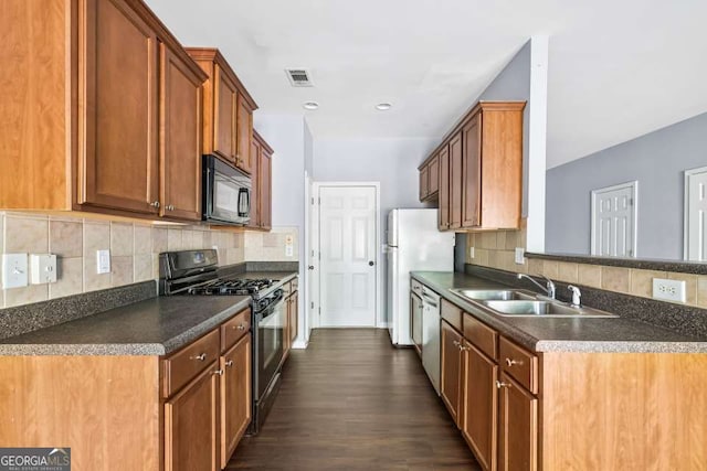 2872 Cross Creek Ct, Cumming, GA 30040 - kitchen with a sink, dark countertops, visible vents, backsplash, and black appliances