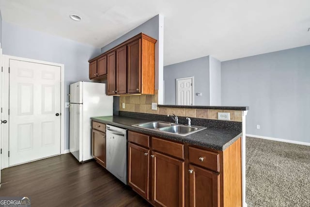 2872 Cross Creek Ct, Cumming, GA 30040 - kitchen featuring dark countertops, dishwasher, freestanding refrigerator, and a sink