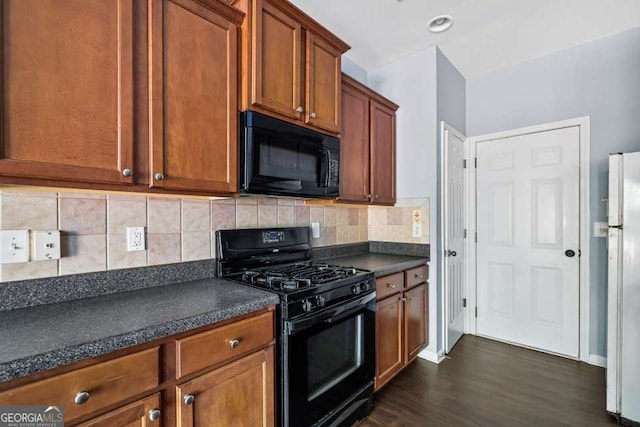 2872 Cross Creek Ct, Cumming, GA 30040 - kitchen with dark countertops, decorative backsplash, dark wood-type flooring, and black appliances