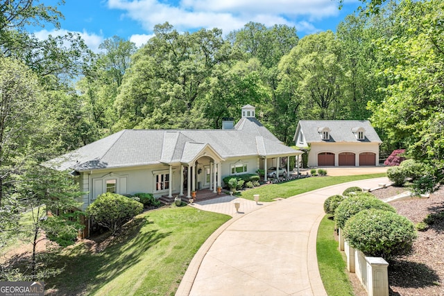 2436 Hawthorne Ln, Gainesville, GA 30506 - view of front of home featuring curved driveway, a front lawn, a porch, and stucco siding