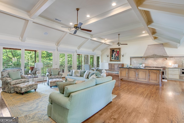 2436 Hawthorne Ln, Gainesville, GA 30506 - living area featuring a ceiling fan, light wood finished floors, visible vents, crown molding, and lofted ceiling with beams