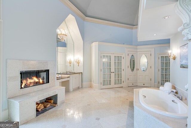 2436 Hawthorne Ln, Gainesville, GA 30506 - bathroom with a premium fireplace, ornamental molding, vanity, a tub to relax in, and recessed lighting