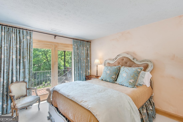 2436 Hawthorne Ln, Gainesville, GA 30506 - carpeted bedroom featuring baseboards, visible vents, a textured ceiling, and access to exterior