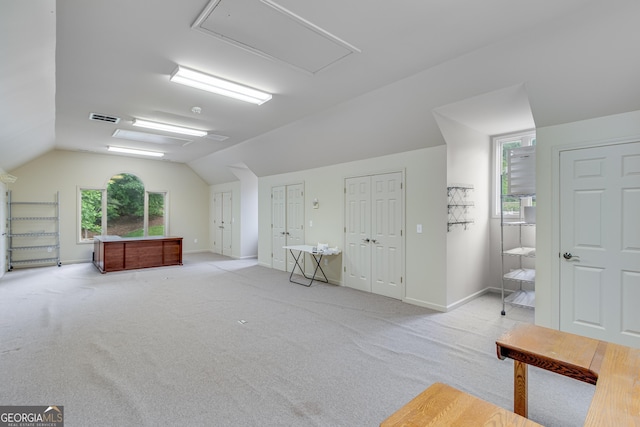2436 Hawthorne Ln, Gainesville, GA 30506 - additional living space featuring attic access, light carpet, visible vents, baseboards, and vaulted ceiling