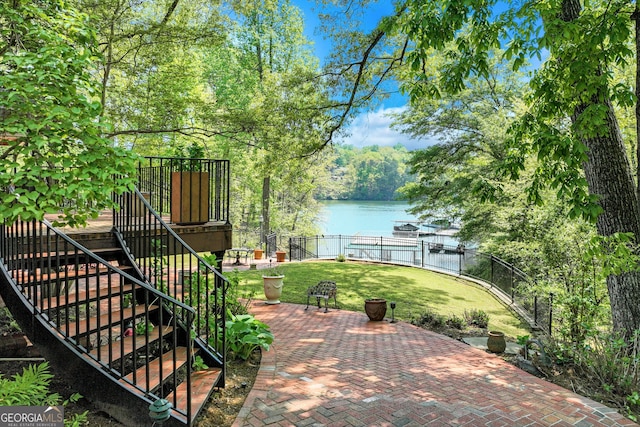 2436 Hawthorne Ln, Gainesville, GA 30506 - exterior space with a yard, fence, a water view, stairs, and a patio area