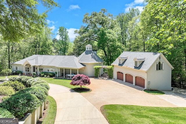 2436 Hawthorne Ln, Gainesville, GA 30506 - view of front of house with a front yard, stucco siding, and curved driveway