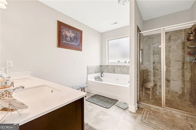 1129 Abundance Dr, Locust Grove, GA 30248 - bathroom with a shower stall, double vanity, visible vents, a sink, and a bath