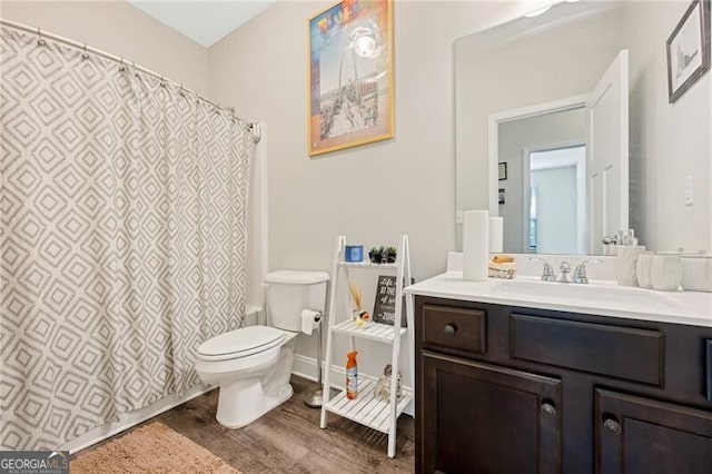 1129 Abundance Dr, Locust Grove, GA 30248 - bathroom with toilet, a shower with shower curtain, vanity, and wood finished floors