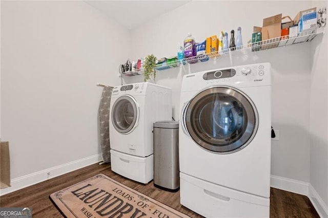 1129 Abundance Dr, Locust Grove, GA 30248 - laundry room featuring washer and dryer, wood finished floors, and laundry area
