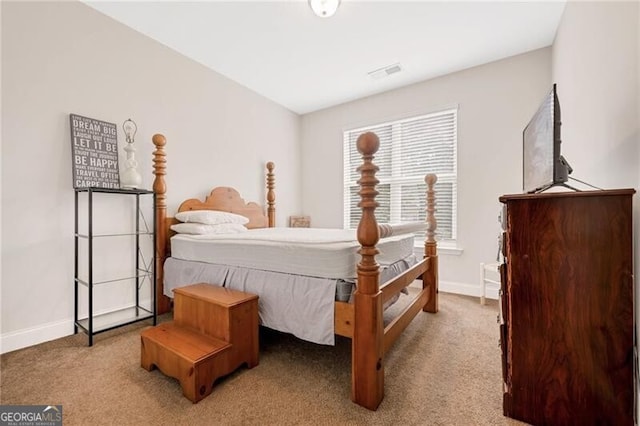 1129 Abundance Dr, Locust Grove, GA 30248 - carpeted bedroom featuring visible vents and baseboards