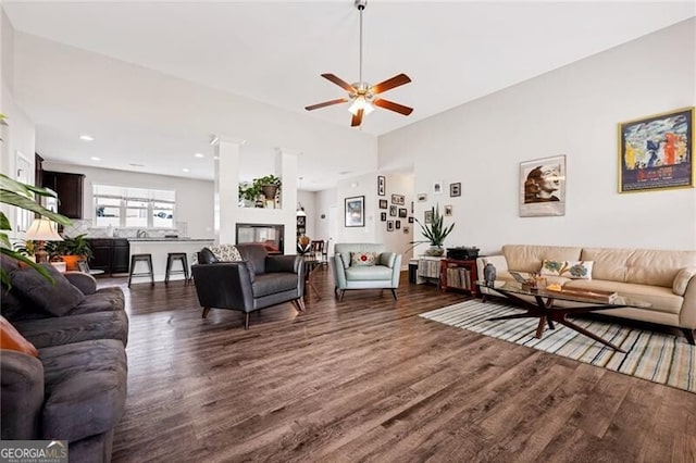 1129 Abundance Dr, Locust Grove, GA 30248 - living area with dark wood finished floors and ceiling fan