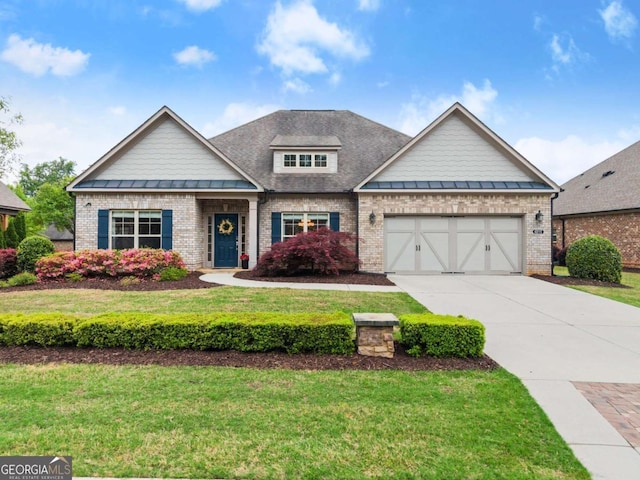 4815 Amble Trce, Cumming, GA 30040 - craftsman-style home featuring brick siding, driveway, and a standing seam roof