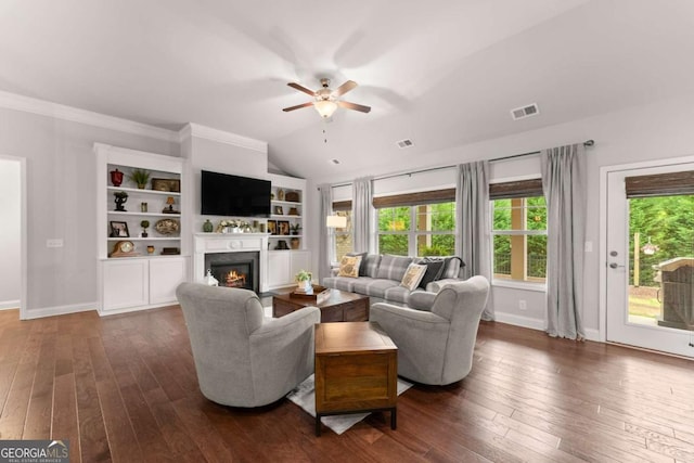 4815 Amble Trce, Cumming, GA 30040 - living area featuring ceiling fan, dark wood-type flooring, a glass covered fireplace, baseboards, and lofted ceiling