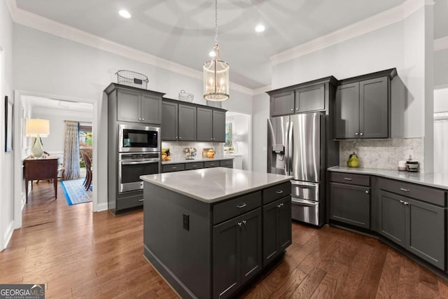 4815 Amble Trce, Cumming, GA 30040 - kitchen with stainless steel appliances, a kitchen island, recessed lighting, ornamental molding, and light countertops