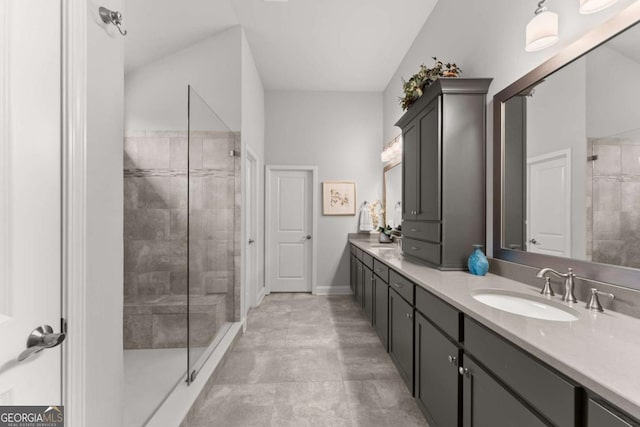 4815 Amble Trce, Cumming, GA 30040 - bathroom featuring double vanity, a tile shower, and baseboards