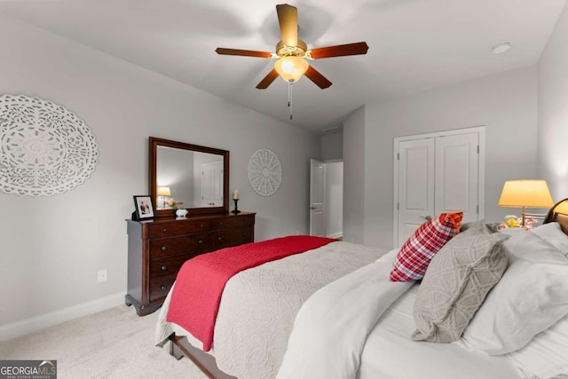 4815 Amble Trce, Cumming, GA 30040 - bedroom featuring light carpet, baseboards, ceiling fan, and a closet