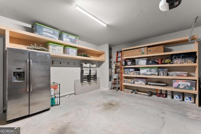 4815 Amble Trce, Cumming, GA 30040 - garage featuring stainless steel fridge and a garage door opener