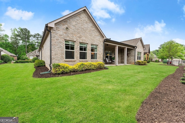 4815 Amble Trce, Cumming, GA 30040 - rear view of house with a patio area and brick siding