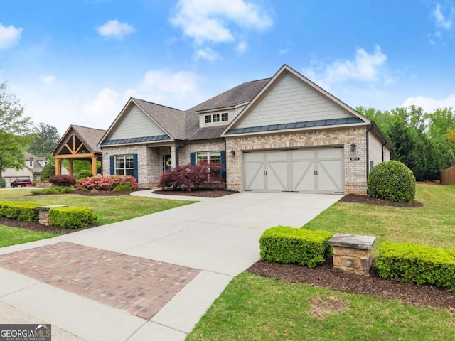 4815 Amble Trce, Cumming, GA 30040 - craftsman inspired home featuring concrete driveway, brick siding, a garage, a standing seam roof, and a front yard