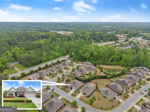 4815 Amble Trce, Cumming, GA 30040 - aerial perspective of suburban area featuring a heavily wooded area