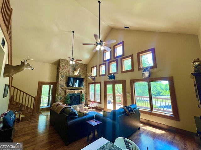 54 Lodge Ground Ln, Hawkinsville, GA 31036 - living room with high vaulted ceiling, a ceiling fan, wood finished floors, stairs, and a fireplace