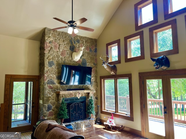 54 Lodge Ground Ln, Hawkinsville, GA 31036 - living area featuring wood finished floors, french doors, a fireplace, high vaulted ceiling, and ceiling fan