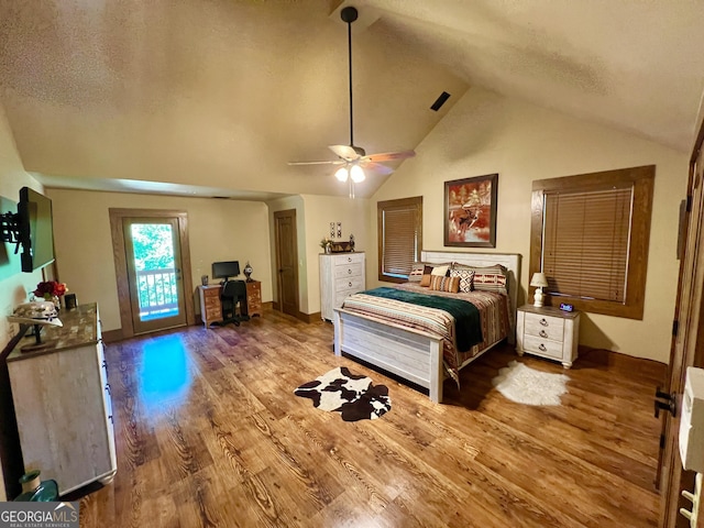 54 Lodge Ground Ln, Hawkinsville, GA 31036 - bedroom featuring access to outside, wood finished floors, lofted ceiling, and ceiling fan