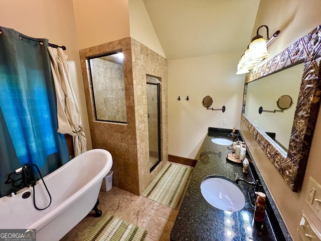 54 Lodge Ground Ln, Hawkinsville, GA 31036 - bathroom featuring lofted ceiling, a freestanding tub, a sink, and double vanity