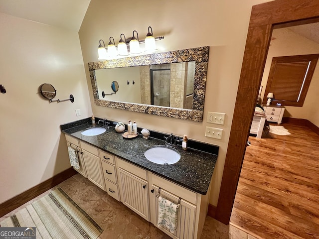 54 Lodge Ground Ln, Hawkinsville, GA 31036 - bathroom featuring baseboards, a sink, and double vanity