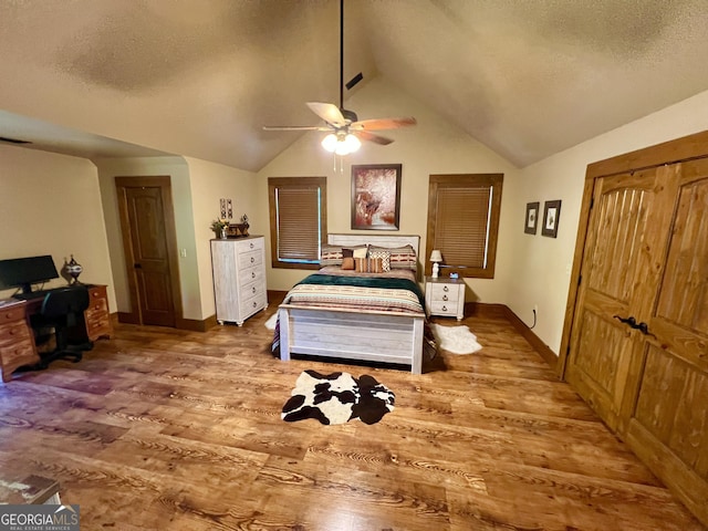 54 Lodge Ground Ln, Hawkinsville, GA 31036 - bedroom featuring vaulted ceiling, wood finished floors, a textured ceiling, and baseboards