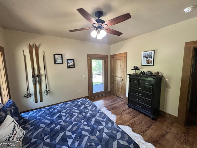 54 Lodge Ground Ln, Hawkinsville, GA 31036 - bedroom featuring ceiling fan, access to exterior, baseboards, and dark wood-style flooring