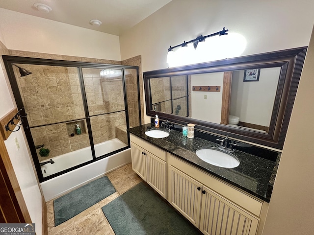 54 Lodge Ground Ln, Hawkinsville, GA 31036 - bathroom with enclosed tub / shower combo, toilet, a sink, and double vanity