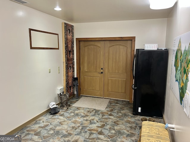 54 Lodge Ground Ln, Hawkinsville, GA 31036 - foyer featuring baseboards, visible vents, and stone floors