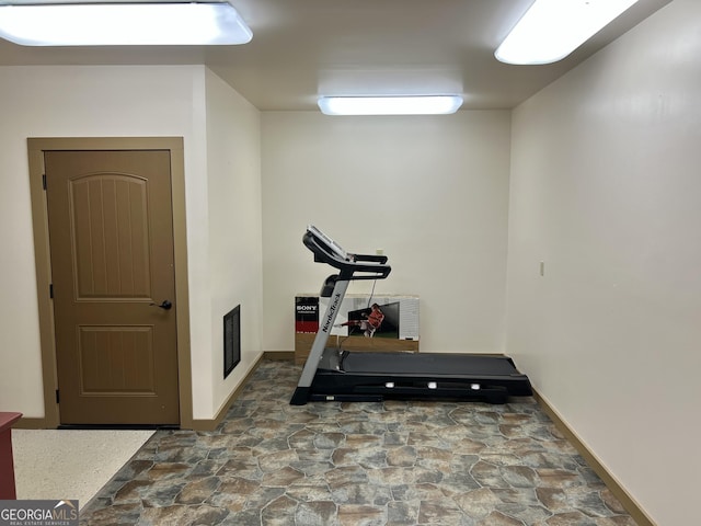 54 Lodge Ground Ln, Hawkinsville, GA 31036 - workout area with stone finish flooring and visible vents