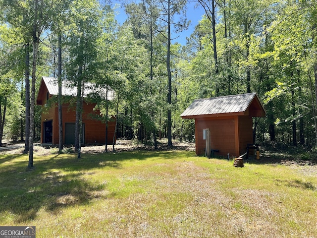 54 Lodge Ground Ln, Hawkinsville, GA 31036 - view of yard with an outdoor structure