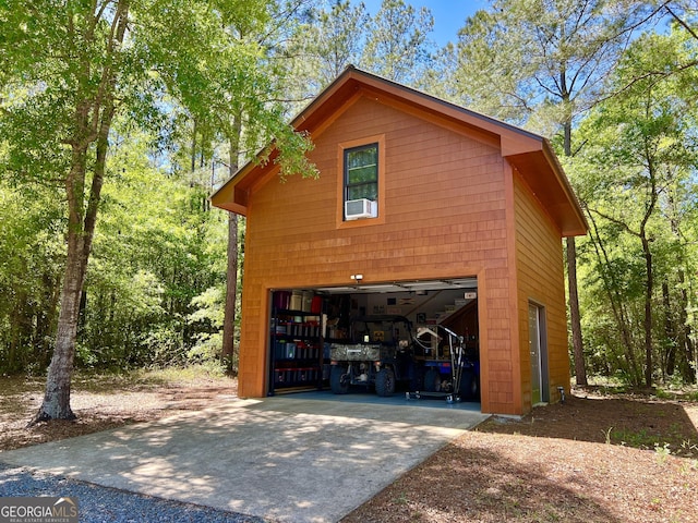 54 Lodge Ground Ln, Hawkinsville, GA 31036 - view of side of home featuring concrete driveway and a garage